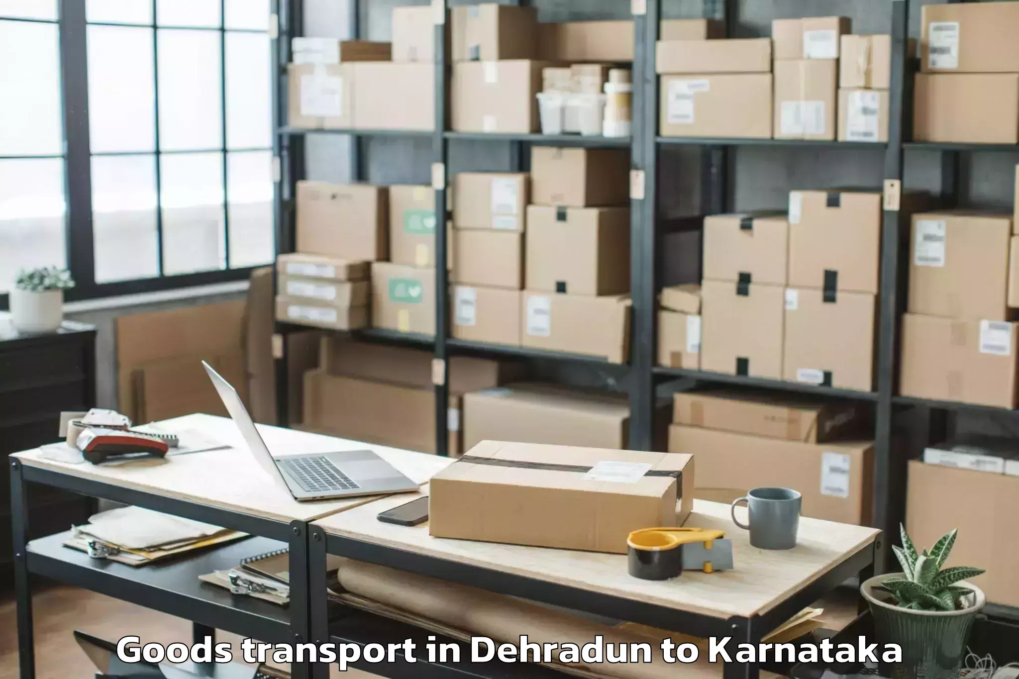 Book Dehradun to Rani Channamma University Bela Goods Transport Online